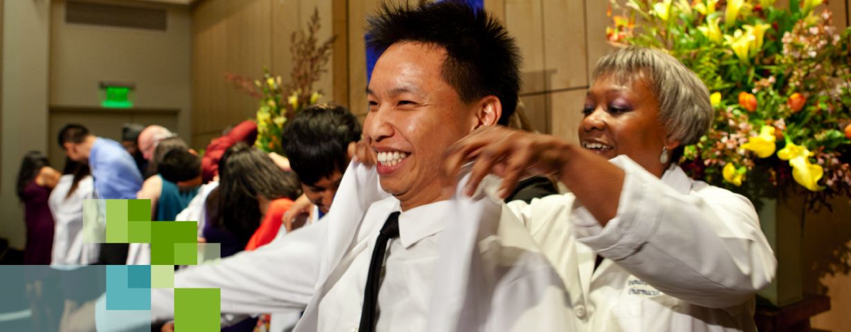 UCSF PharmD student receiving white coat in ceremony