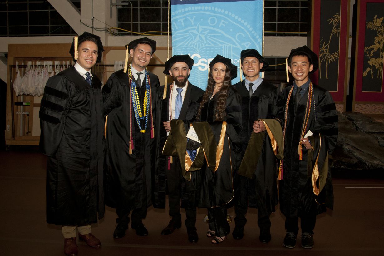Six students standing in graduation gowns