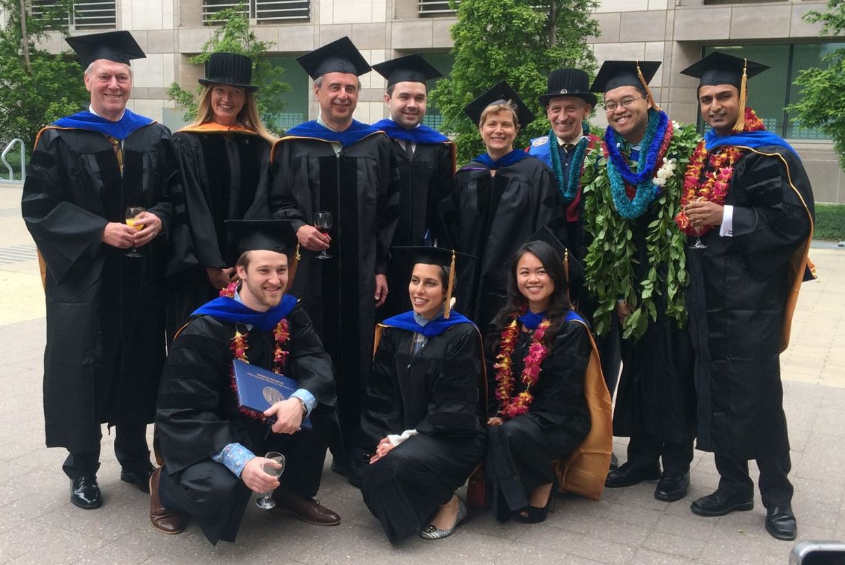 graduates with faculty members