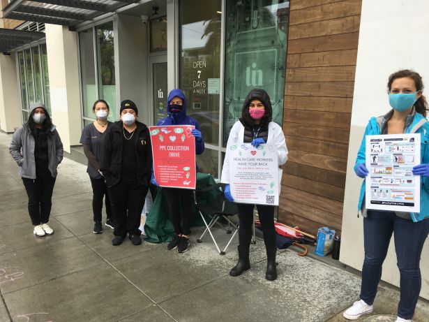 PharmD students and pharmacy staff in front of pharmacy