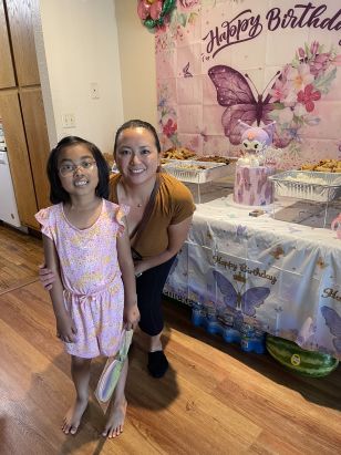 Reyles-Derry with Icing Smiles patient and cake she delivered