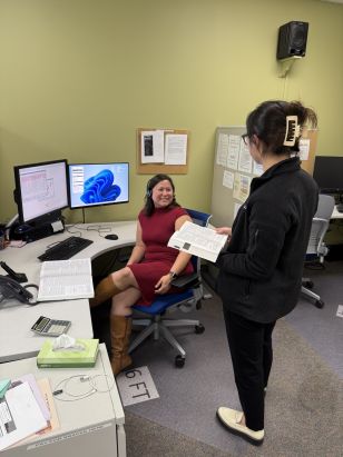 Huntington at desk in call center