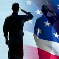 silhouette of soldier against U.S. flag