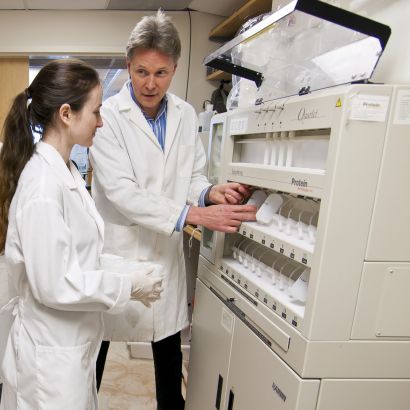Craik with student in lab
