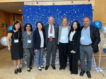 Baluom with colleagues surrounding Benet