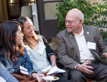 Levin chatting with students.