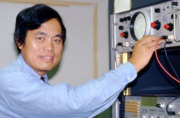 Peng adjusting scientific equipment