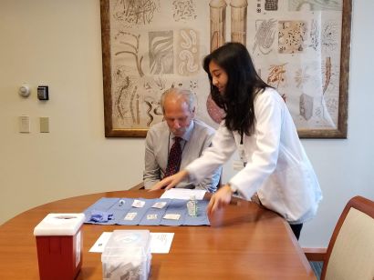 PharmD student prepares flu vaccine for the dean