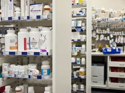 Medication bottles on shelves in a pharmacy