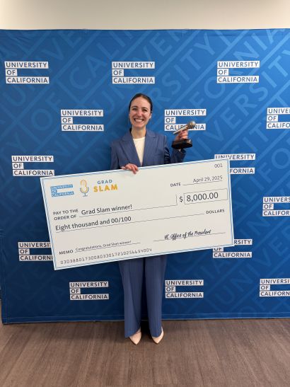 student with Grad Slam trophy