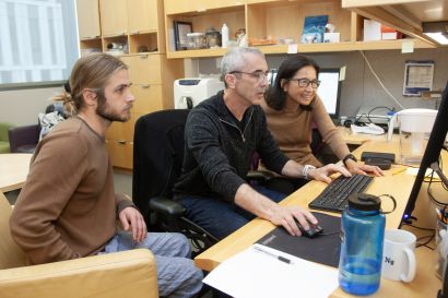 (from L to R) Kumbier works with Altschuler and Wu at computer
