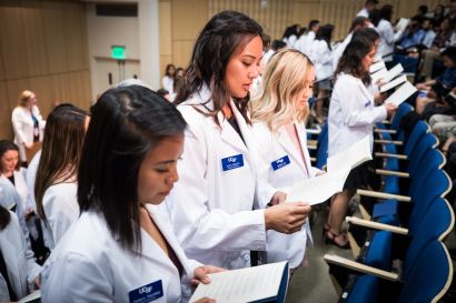 students wearing white coats