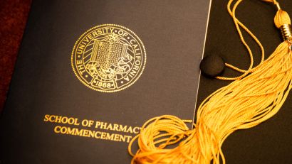 UCSF School of Pharmacy commencement program pamphlet with graduation cap and tassel