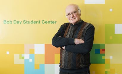 Day with sign from Bob Day Student Center