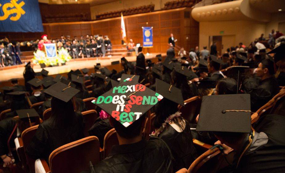 graduate with slogan on hat: "Mexico does send its best"