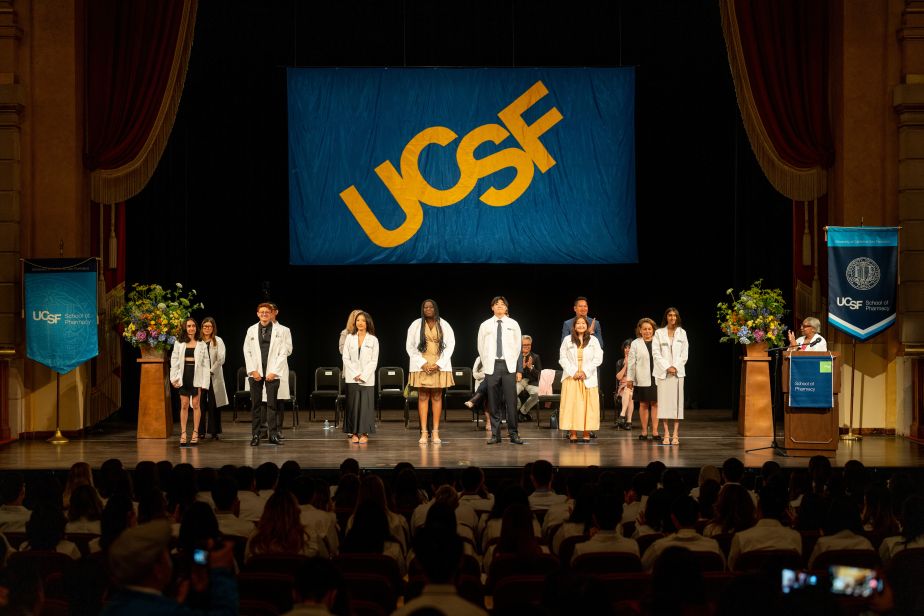 students after receiving white coats.