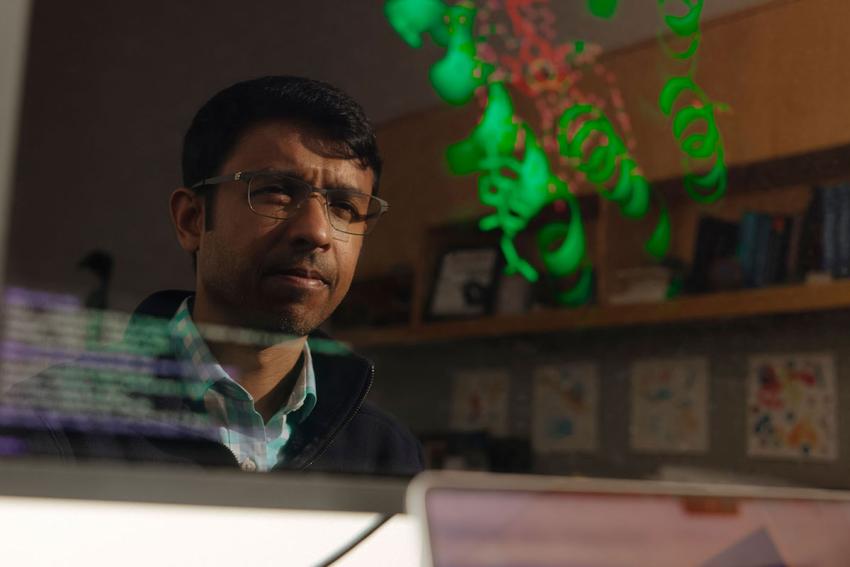 researcher looking at cellular imaging