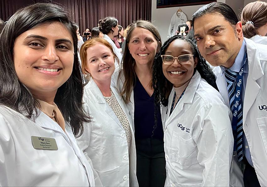 Dhara, Hanna, Ashan, Watkins-Griffin and Joel Daniel Ponce in white coats