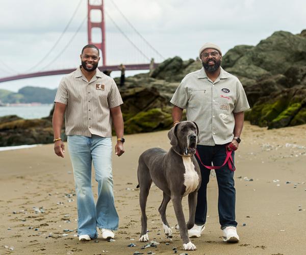 Parella (right) with his partner and dog with Golden Gate Bridge in background